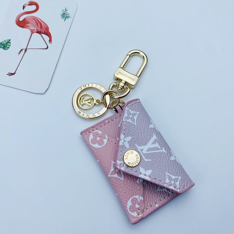 Schlüsselanhänger mit rosa Mädchen-Anhänger