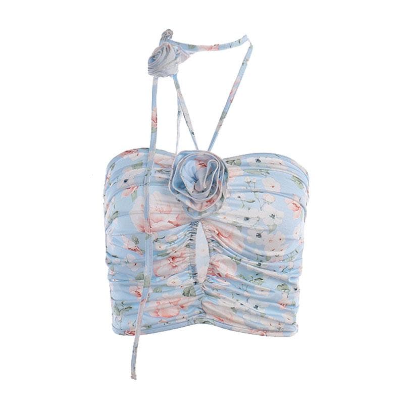 Top corto con schiena scoperta, scollo all'americana, bottoni traforati a contrasto e stampa floreale arricciata