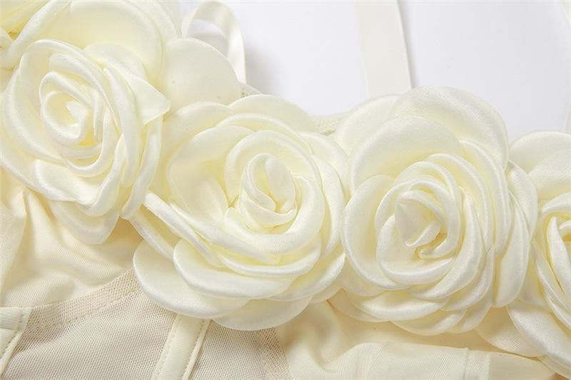 Top corto bustier con schiena scoperta e applicazione di fiori in rete