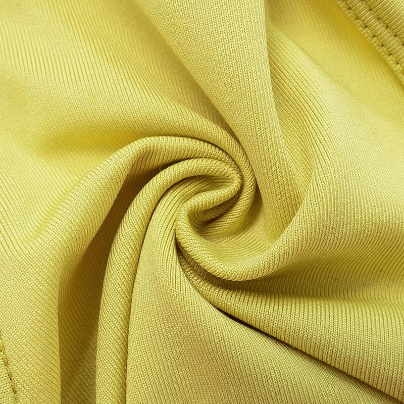 Completo pantaloni a tubo con schiena scoperta e applicazioni floreali a contrasto