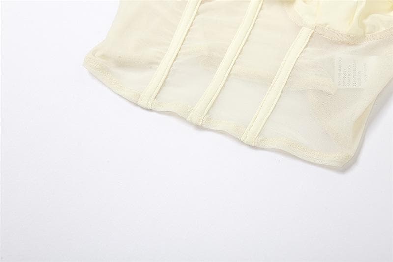 Top corto bustier con schiena scoperta e applicazione di fiori in rete