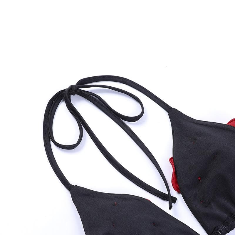 Neckholder-Hosenset zum Selbstbinden mit kontrastierender Blumenapplikation und überkreuztem Rücken