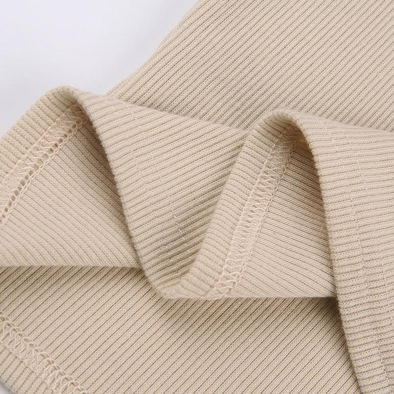 Geripptes Langarm-Oberteil mit Rundhalsausschnitt und Sternen-Patchwork in Kontrastfarbe