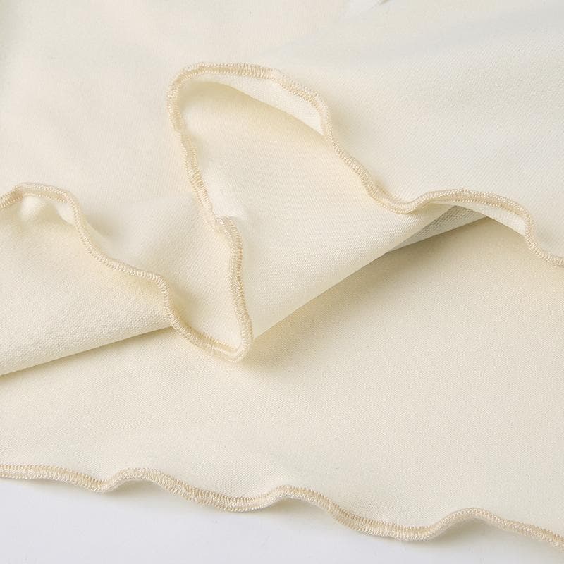 Top corto a tubino con volant e schiena scoperta a contrasto con motivo ad angelo