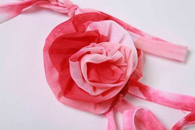 Rückenfreies, bauchfreies Top mit V-Ausschnitt, Blumenapplikation und kontrastierendem Schlitz zum Selbstbinden