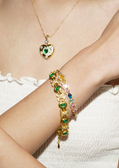 Bracciale dorato con pietre preziose verdi scintillanti Serena