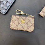 Graue Münzbörse mit Kette