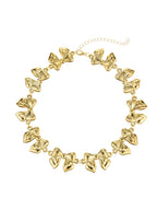 Cleo – Goldene Choker-Halskette mit riesiger Schleife