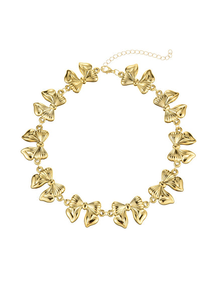 Cleo – Goldene Choker-Halskette mit riesiger Schleife