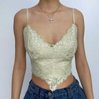 Top corto in pizzo con scollo a V e schiena scoperta, applicazioni floreali a contrasto