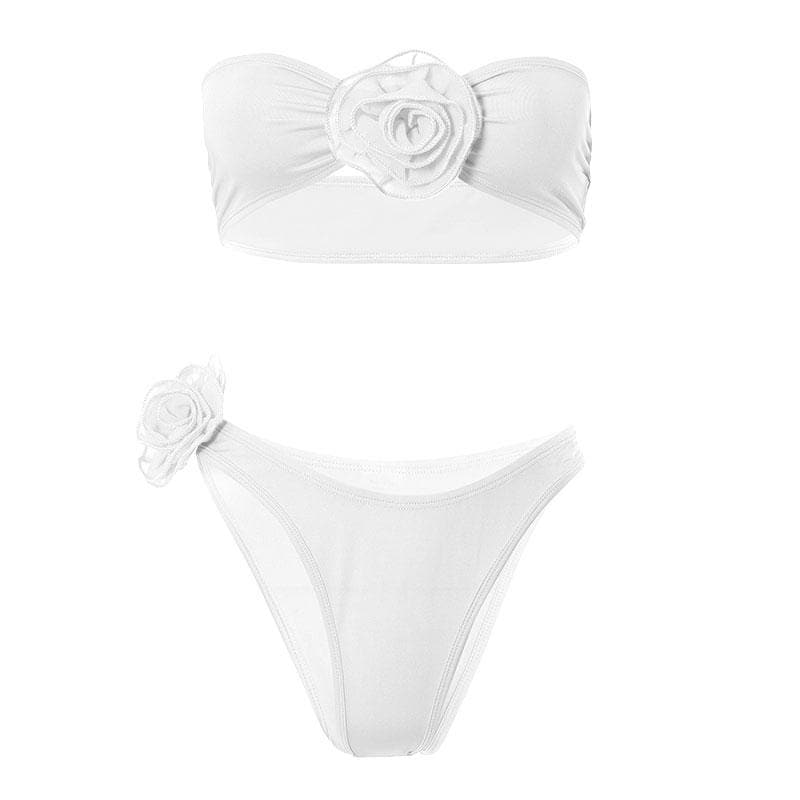 Completo pantaloni a tubo con schiena scoperta e applicazioni floreali a contrasto 