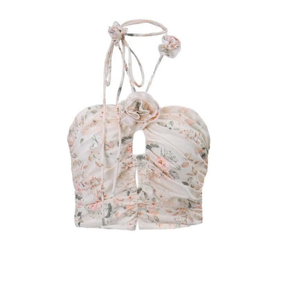 Top corto con schiena scoperta, scollo all'americana, bottoni traforati a contrasto e stampa floreale arricciata 