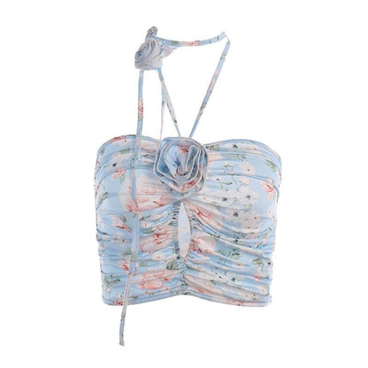 Top corto con schiena scoperta, scollo all'americana, bottoni traforati a contrasto e stampa floreale arricciata 