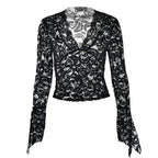 Top trasparente in pizzo con scollo a V e maniche svasate