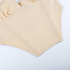 Sleeveless solid metal tag notch neck backless crop top