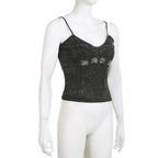 Top corto in denim con scollo a V, zip e schiena scoperta 