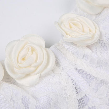 Top a tubino senza schienale con applicazioni di fiori in pizzo e bottoni patchwork