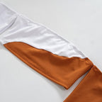 Minigonna a maniche lunghe con spalle scoperte e schiena scoperta, patchwork a contrasto