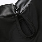 Top corto in similpelle con bottoni patchwork senza maniche e fibbia
