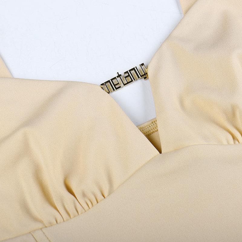 Sleeveless solid metal tag notch neck backless crop top