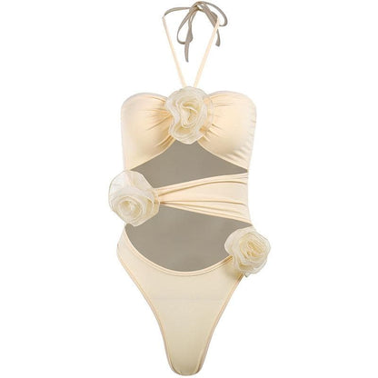 Bodysuit con scollo all'americana, schiena scoperta, arricciato e applicazioni di fiori traforati
