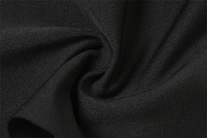 Top corto con scollo all'americana, annodato a mano, con nastro traforato e arricciato sulle spalle