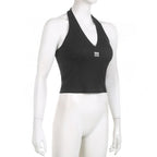 Top corto con scollo a V, schiena nuda e coste ricamate all'americana 