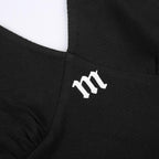 Top corto con scollo a V, schiena nuda e coste ricamate all'americana 