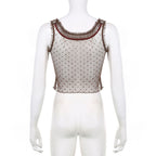 Top corto senza maniche in rete con volant patchwork 