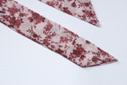 Abito lungo senza maniche con scollo a V e schiena scoperta a contrasto con stampa floreale in chiffon 