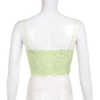 Top corto in pizzo con scollo a V e schiena scoperta, applicazioni floreali a contrasto
