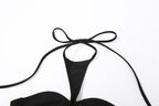 Top corto con spalline sottili e bottoni, allacciatura posteriore e chiusura a strappo 