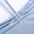 Top corto in due pezzi con collo alto, maniche lunghe e arricciate 