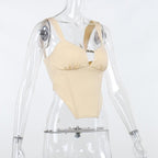 Sleeveless solid metal tag notch neck backless crop top
