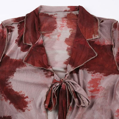 Top corto in rete trasparente con volant tie-dye a maniche lunghe e annodabile