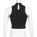 Top corto in similpelle con bottoni patchwork senza maniche e fibbia