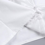 Top corto con scollo quadrato, maniche a cappuccio e bottoni, tinta unita e arricciato 