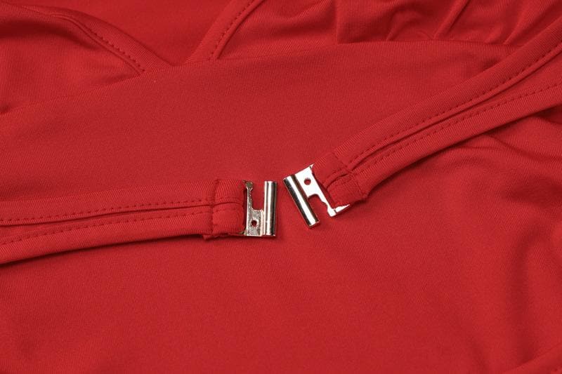 Tuta intera a maniche lunghe con scollo a V e fibbia traforata 