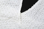 Top corto testurizzato con scollo a V e schiena scoperta 