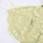 Top corto in pizzo con scollo a V e schiena scoperta, applicazioni floreali a contrasto