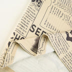 Gonna midi a vita alta con spacco e stampa di giornale a contrasto 