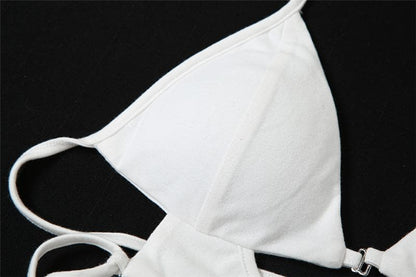 Top corto con scollo a V traforato, schiena scoperta e lacci 
