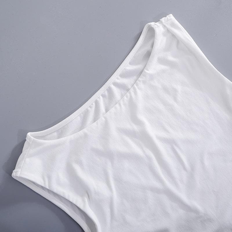 Top solido con spacchi irregolari sulle spalle e bottoni 